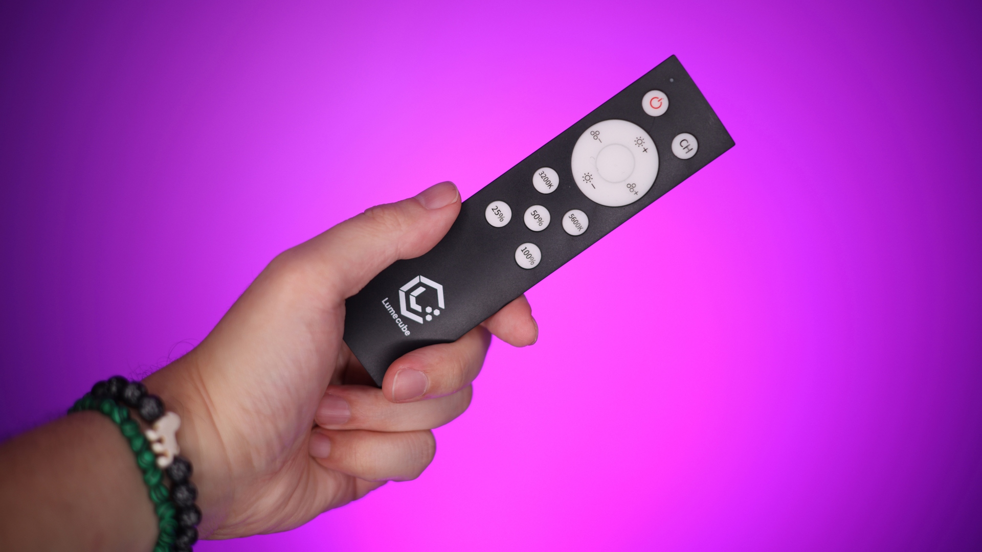 Lume Cube Right Light Pro review image showing a hand holding a controller.