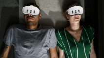 Two people lying down of the floor with meta quest 3 headsets imposed over their faces