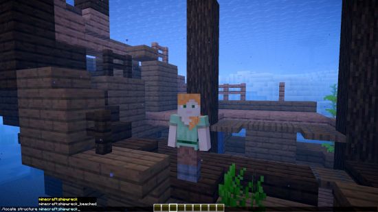 Alex stands on a shipwreck as the locate Minecraft command appears in the lower left corner of the screen.