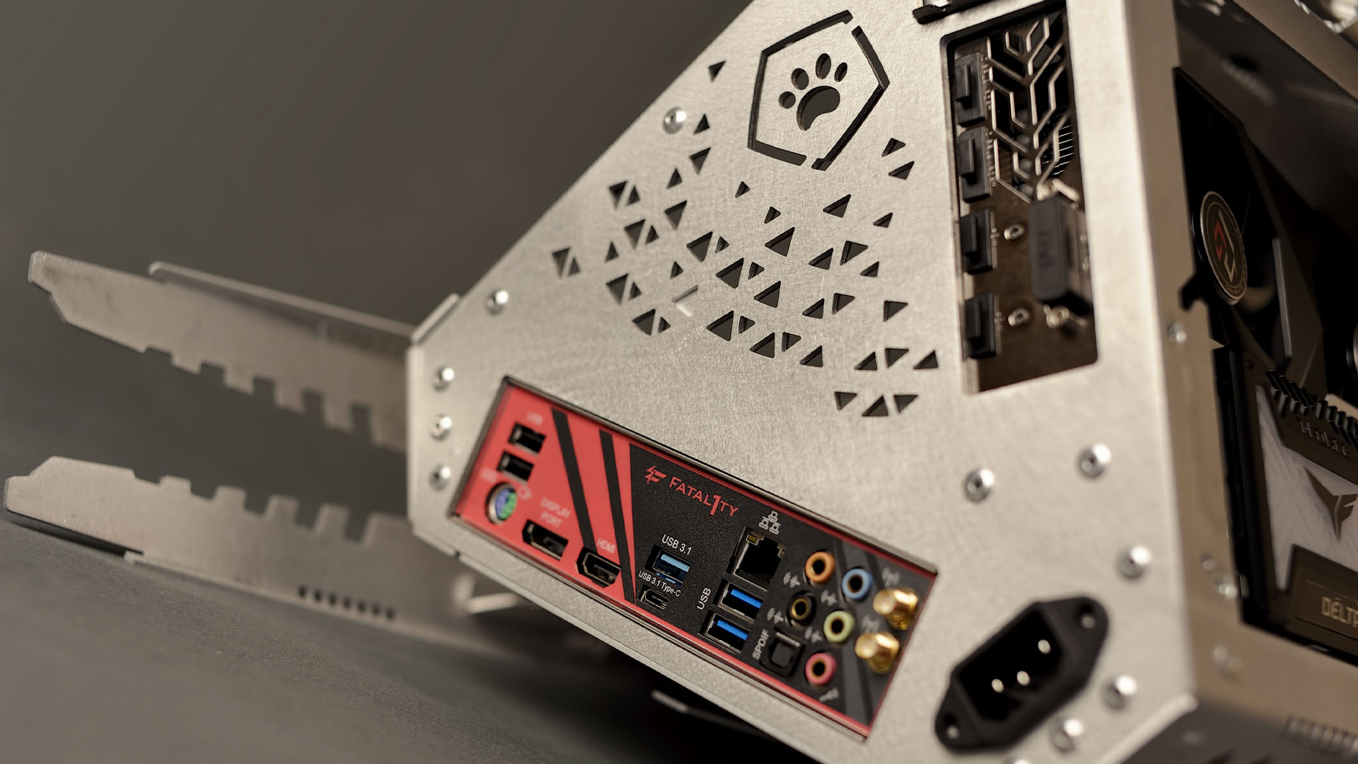 The I/O shield on the back of the sputnik triangular gaming pc