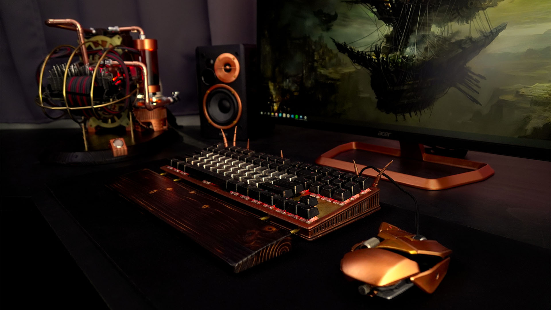 The steampunk PC build together with a monitor and custom keyboard