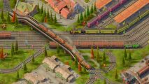 Factorio style, train focused management game leaves Early Access: An overhead view of trains passing through a town.