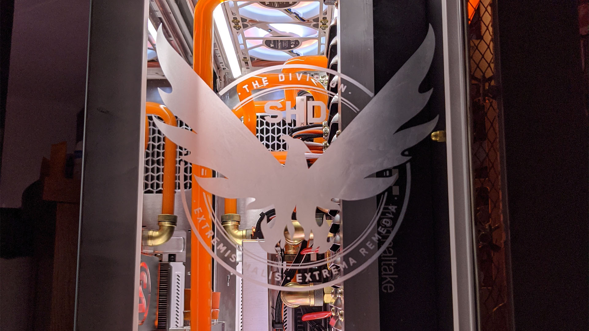 The etching of a The Division 2 logo on the front of a gaming PC
