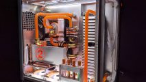 The custom gaming PC in white with orange water cooling to look like something out of The Division 2