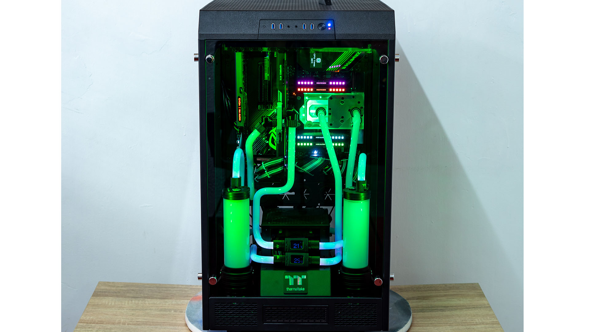 The AMD threadripper gaming PC with green collant and RGB lighting
