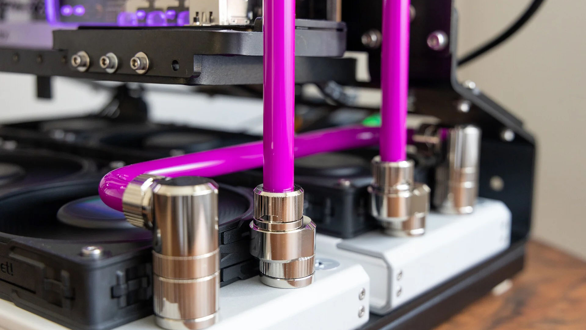 The watercooling tubing carrying a magenta colored coolant
