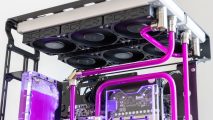 A magenta coolant filled gaming PC with four 360mm radiators