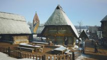 Manor Lords mods: a medieval town covered in a layer of snow