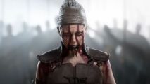 Hellblade 2 Steam launch: a woman looks angry, dressed leather with red paint on her eyes and a bright light shining behind her