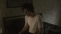 Most underrated Silent Hill game gets live action fan film recreation: The actor playing Henry Townshend sits on his bed in this fan recreation of Silent Hill 4.