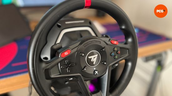 Thrustmaster T128 steering wheel with blurred background 
