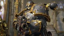 Warhammer 40k Space Marine 2 gets new Helldivers 2 style co-op mode: A black and gold Space Marine raises a huge gun towards the camera