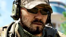 New Tarkov and Arma rival Gray Zone Warfare celebrates huge milestone one month on - A bearded soldier wearing a tan camo hat, an olive green headset, and dark sunglasses.
