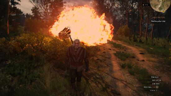 Geralt of Rivia walks away from an explosion