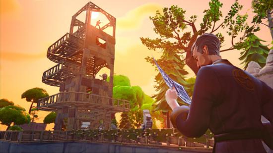 A handsome ninja looks at blueprints while a tower takes shape in the sunset skyline in the background.