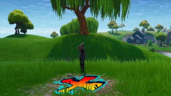 Fortnite search between covered bridge waterfall 9th green location