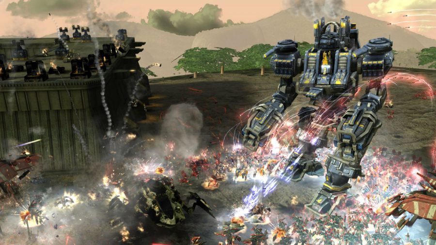 Hundreds of smaller units assault a mech in Supreme Commander 2, one of the best robot games