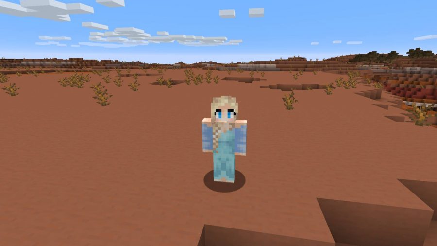 Minecraft skins: Elsa is standing in the middle of a desert.