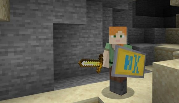 Minecraft shield: a person holding a gold sword and a shield with a custom decoration.