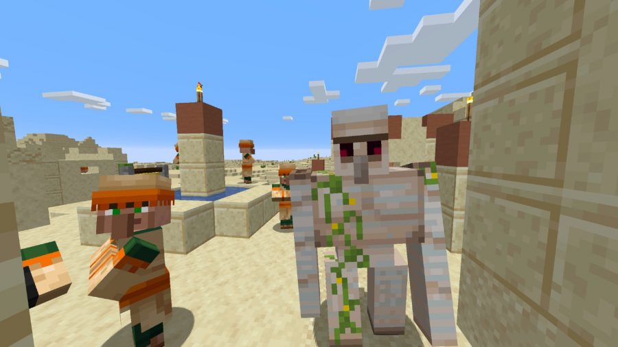 Village Minecraft dans le désert avec un golem de fer et plusieurs villageois