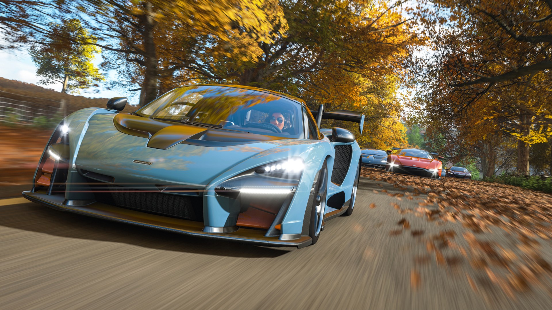 Best open-world games: driving a light-blue sports car down an avenue in Forza Horizon 4.