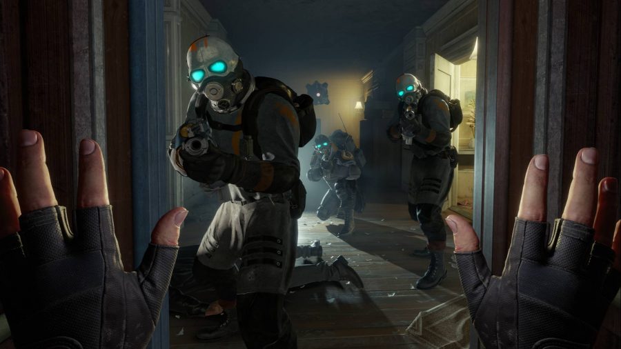 Half-Life Alyx is one of the best VR games available. Here we see three soldiers aiming their guns at Alyx who has her hands up.