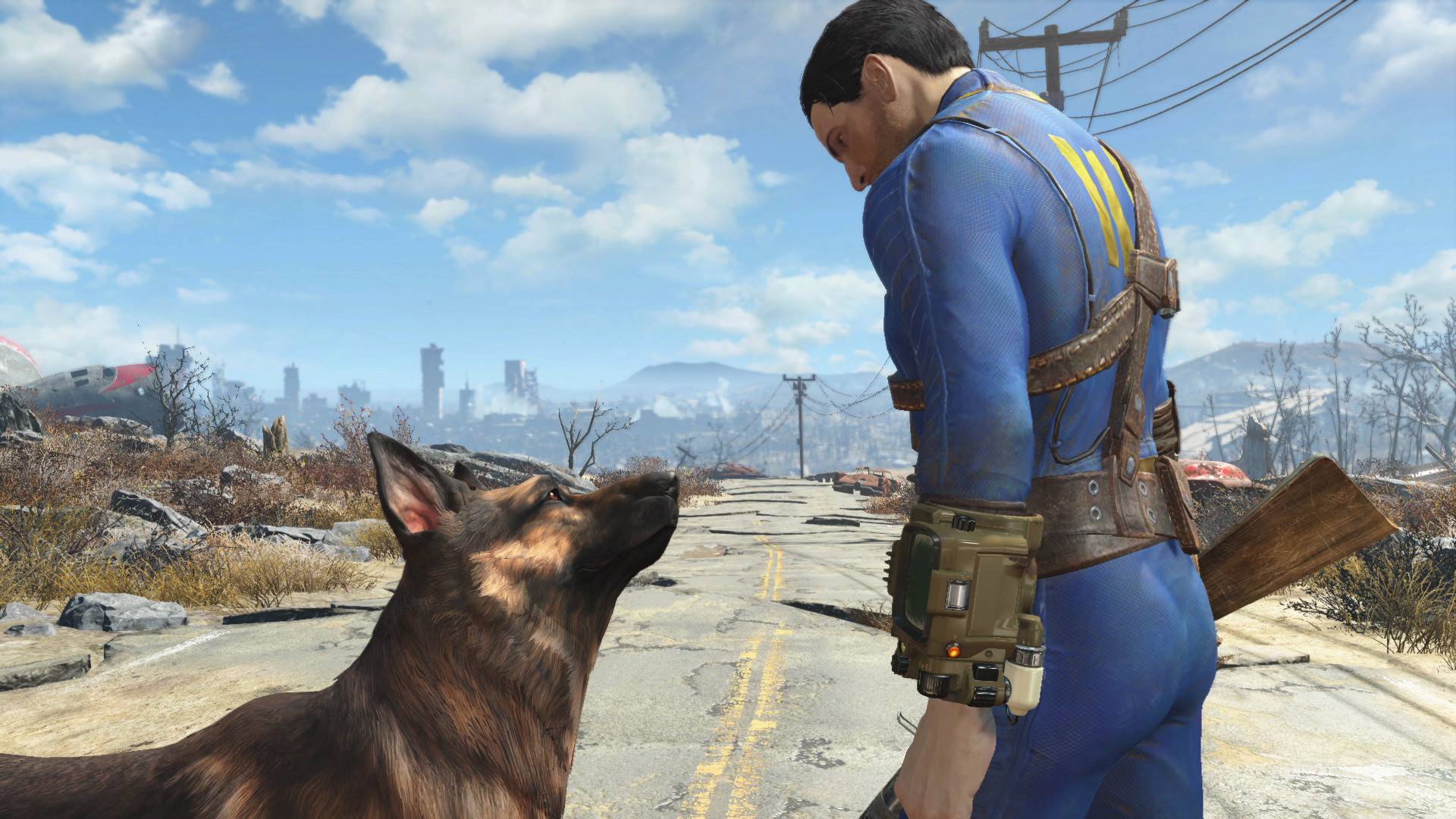 Best open-world games: The Sole Survivors in Fallout 4 looking at Dogmeat, his German Shepherd, as they walk down a dilapidated road.