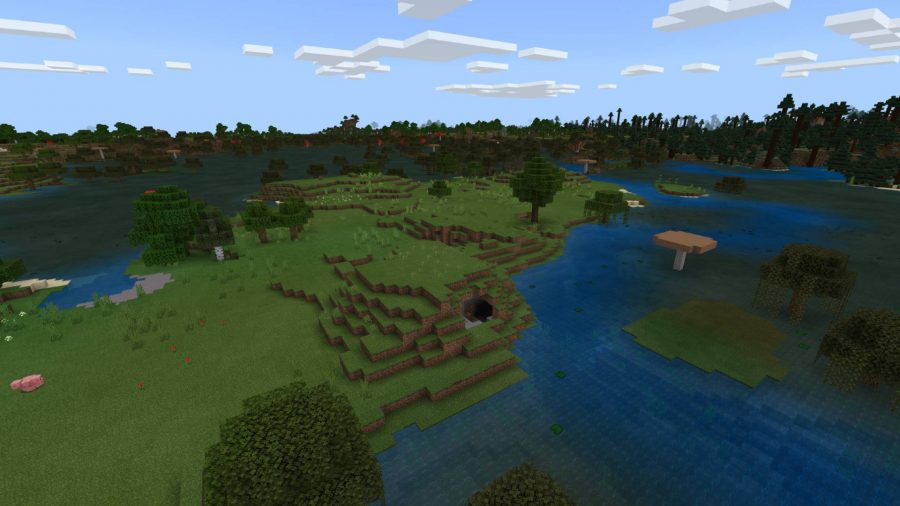 Best Minecraft seeds: a lush swamp in Minecraft, with a river of blue translucent water snaking around a hilly island with trees