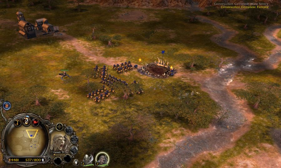 A Warg army is standing close to a small hamlet. Most of the units are on top of Wargs.