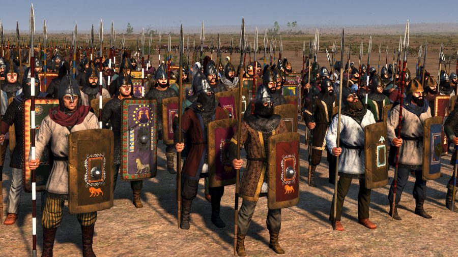 A small army of troops. All have lances and decorative shields.