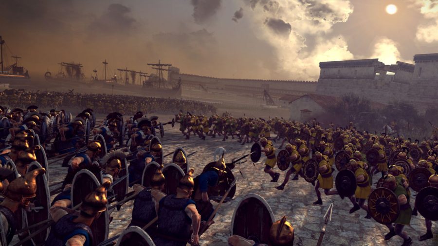 Two armies charging at each other. The yellow army is defending a fort in the background, while the blue army is attacking.