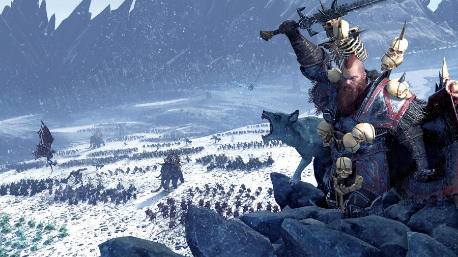 barbarian leader on a hill leading his army forward across snow-covered plain.