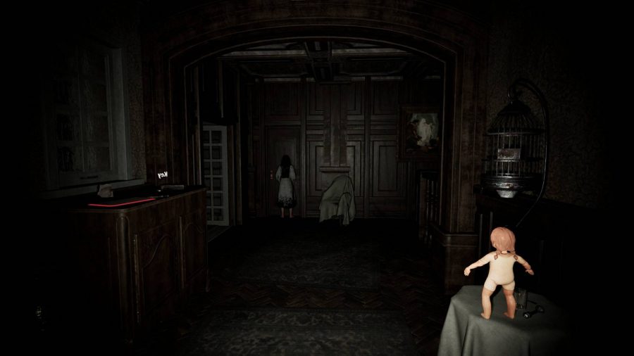 A small doll stood upright on a table as a ghost of a girl hovers by the door in Pacify, one of the best ghost games on PC.