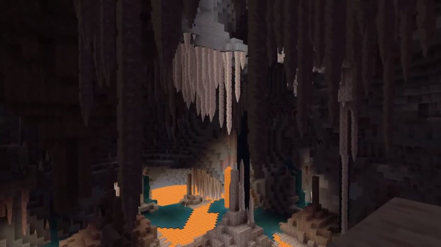 The Dripstone Caves are filled with lava and water pools. Several stalactites and stalagmites can be seen in the distance.