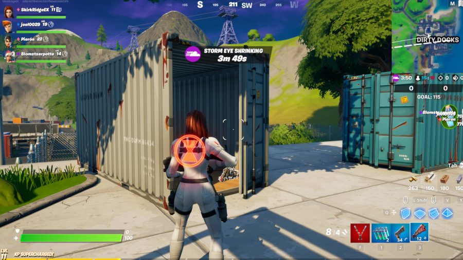 The player is standing outside of the one storage container in Dirty Docks that houses one of the Fortnite car parts.