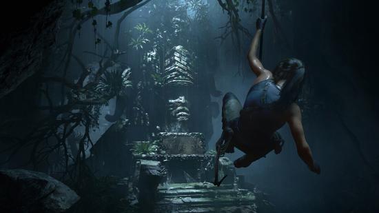 Lara Croft swinging towards an artefact inside of a tomb