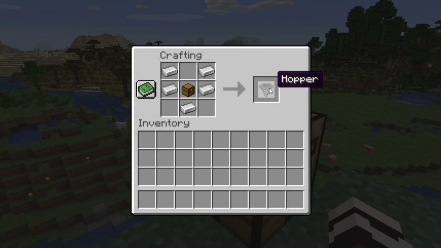 A crafting table interface with five iron blocks V shape surrounding a chest