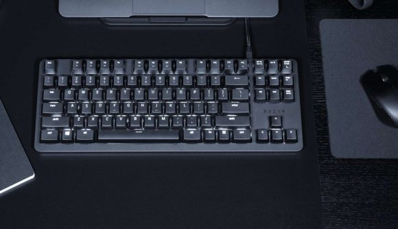Small black keyboard from Razer on an all-black desk