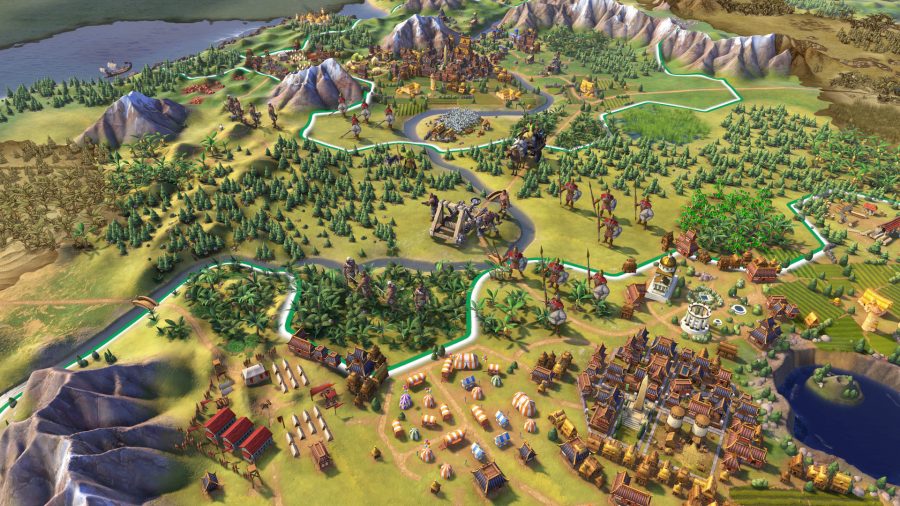 A settlement in Civilization 6, next to a forest, mountains and coastline in the distance