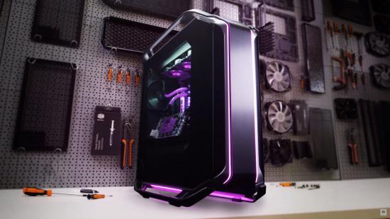 Cooler Master's Cosmos C700M case houses an expensive watercooled build and sits on a workbench in front of tools