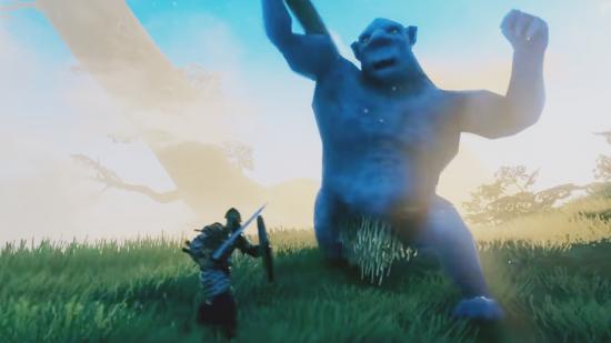 A warrior in Valhelm fighting a huge blue troll, using a sword and shield
