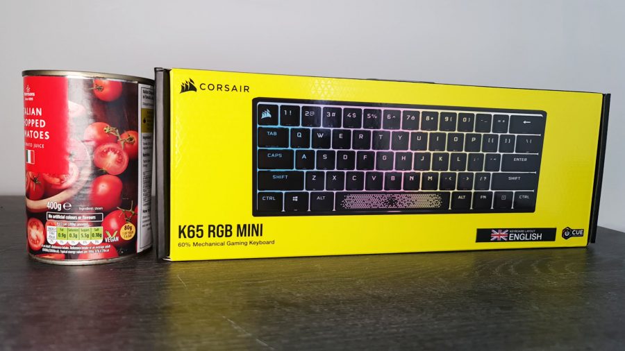 Corsair's K65 RGB Mini gaming keyboard is compared to a tin of tomatos to show how small it is