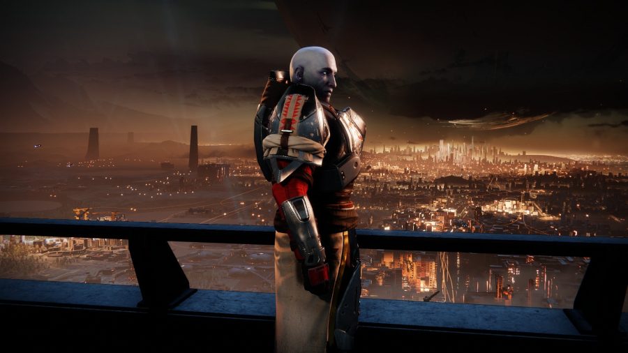 Destiny 2's Commander Zavala, leader of the Vanguard, stands in profile against the lights of Earth's Last City, his attention torn between the player and the city itself