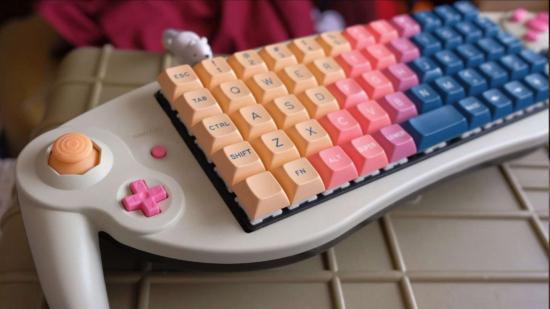 GameCube keyboard with orange, pink, and blue keycaps