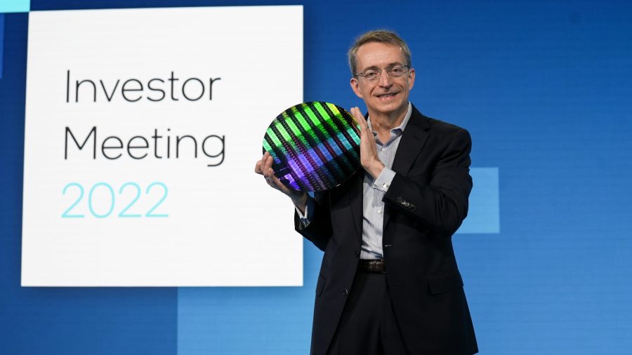 Intel CEO Pat Gelsinger holds a chip wafer at the Intel Investor Meeting 2022 event