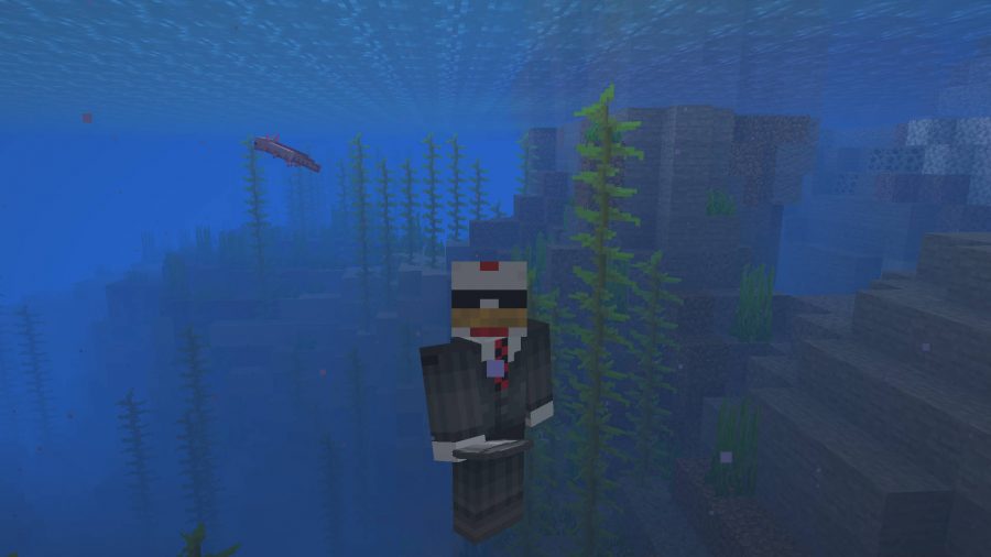 An axolotl in the Minecraft beta Java version swimming in the sea.