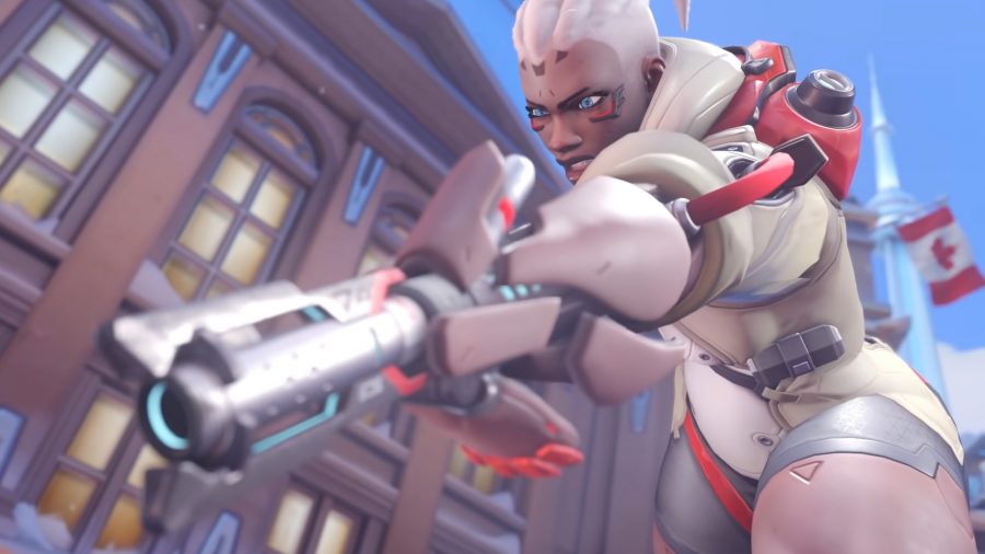 Overwatch 2 release date: Sojorn fires a hand cannon at an enemy behind the scenes