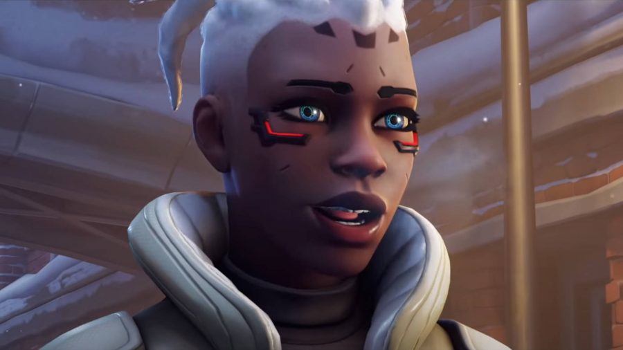 Sojourn is a new hero for Overwatch 2. She is a black woman with white hair and augmented blue eyes.