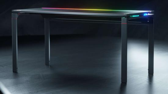A black desk with colourful rainbow RGB lighting on the rear