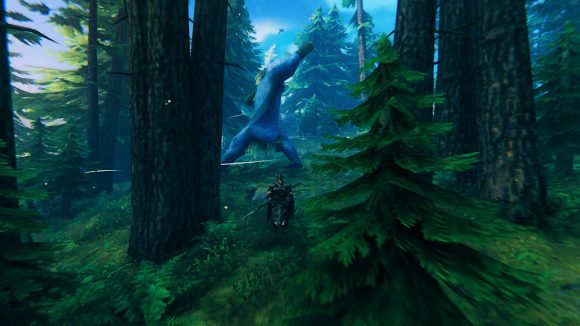 A Valheim player rides a boar away from a troll